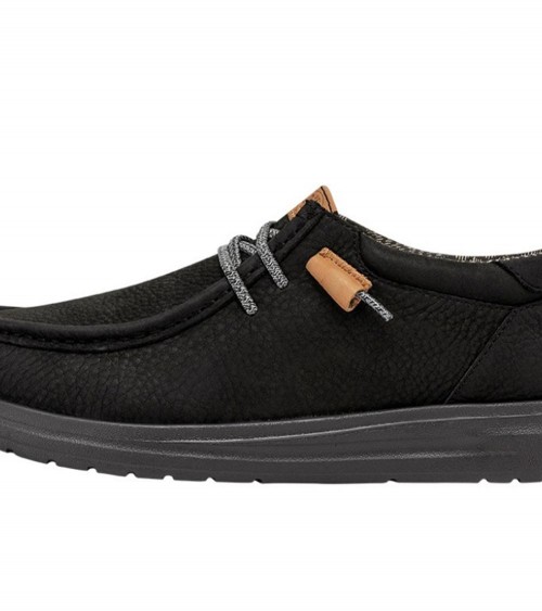 Vista lateral de los DUDE WALLY GRIP CRAFT LEATHER en negro, con suela de goma flexible.