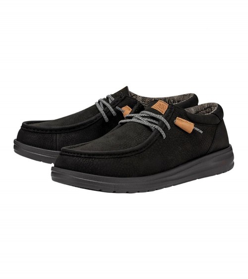 Vista lateral de los DUDE WALLY GRIP CRAFT LEATHER en negro, con suela de goma flexible.